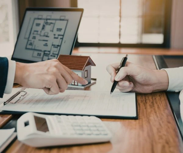 Homebuyer signs real estate contract